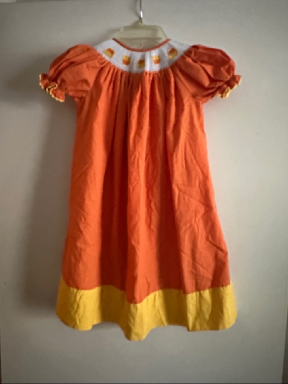 Girls' Orange Dress with Yellow Hem and Smocked Yoke